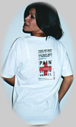 Angelique shows off the back of the Pain Management T-shirt